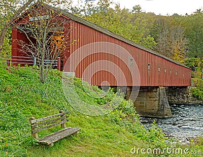 West Cornwall Covered Bridge over Housatonic River in Fall colors Stock Photo