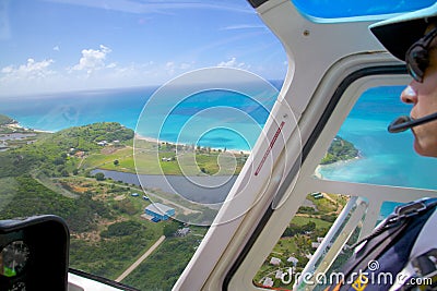 West Indies, Caribbean, Antigua, Helicopter Pilot, Flight over Antigua Editorial Stock Photo