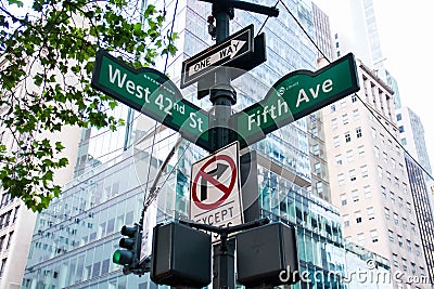 West 42nd Street, Fifth Ave, One way, No turn signs and traffic light on the pole, New York Stock Photo