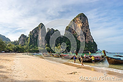 Tourists land in the morning from a Thai long-tail boat on an Editorial Stock Photo