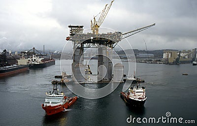 West Tuna a floating Platform is towed out of Port Kembla Harbour. Editorial Stock Photo