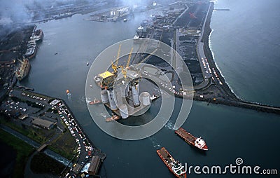 West Tuna a floating Platform is towed out of Port Kembla Harbour. Editorial Stock Photo