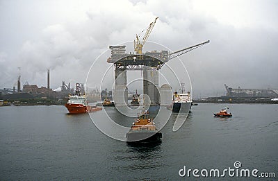 West Tuna a floating Platform is towed out of Port Kembla Harbour. Editorial Stock Photo