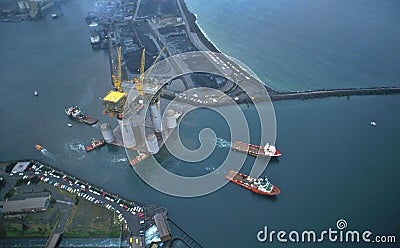 West Tuna is towed out of Port Kembla Harbour aerial image. Stock Photo