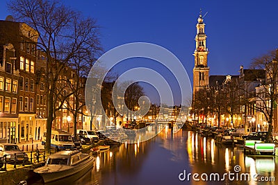 The Western Church and a canal in Amsterdam at night Stock Photo