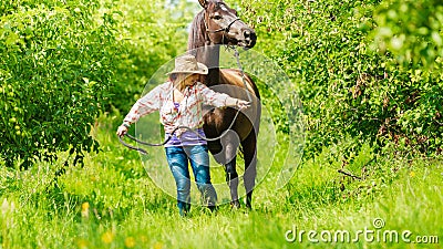 Western cowgirl woman with horse. Sport activity Stock Photo