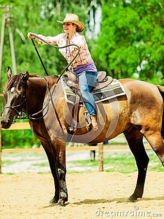 Western cowgirl woman riding horse. Sport activity Stock Photo