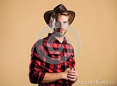 Western fashion. wild west rodeo. Handsome man in hat. man checkered shirt on ranch. Vintage style man. Wild West retro Stock Photo