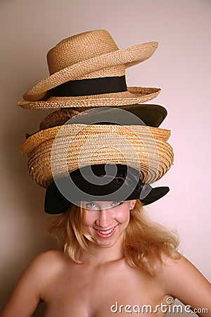 Western girl wearing many hats Stock Photo