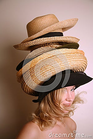 Western girl wearing many hats Stock Photo