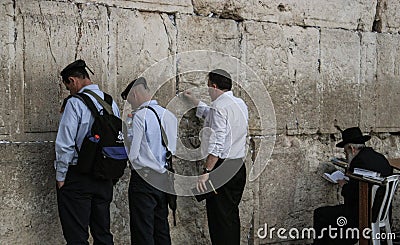 Western Wall, Jerusalem, 03.04.2015, Man sticking a note into th Editorial Stock Photo