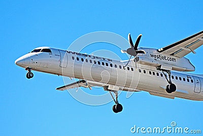 WestJet Encore Bombardier Dash 8 Q400 Front End Close Up Editorial Stock Photo