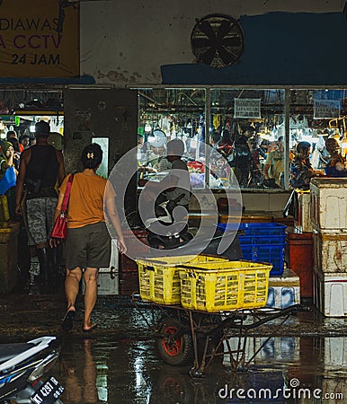 a customer entering the wet area in the market Editorial Stock Photo