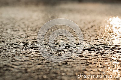 Wet asphalt sidewalk background after heavy rain soft focus. Stock Photo