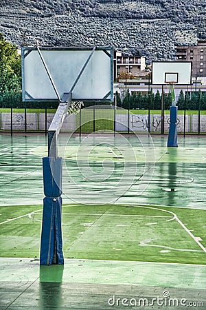 Wet basketball ground Stock Photo