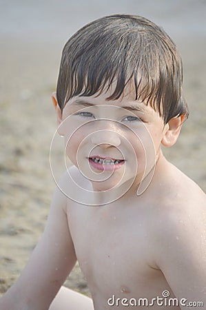 Wet Boy at Beach Stock Photo