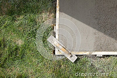 Wet cement slab form work and finishing screed Stock Photo