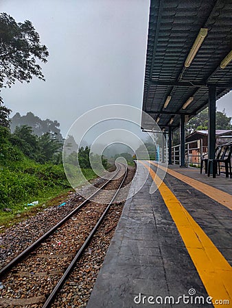 Wet landscape, as rain falls from a cloudy sky in the background Stock Photo