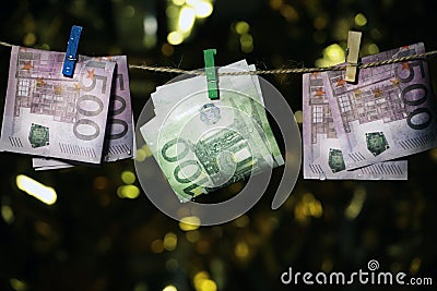 Wet money clothespin gold bokeh Stock Photo