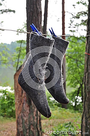 Wet socks drying on a rope Stock Photo