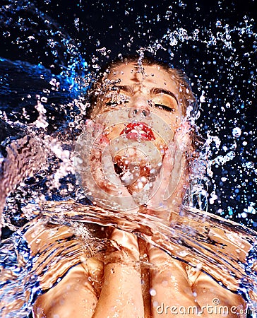 Wet woman face with water drop. Stock Photo