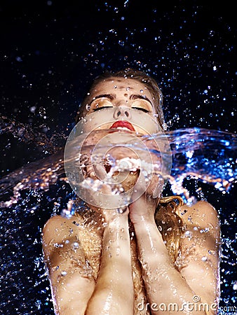 Wet woman face with water drop. Stock Photo