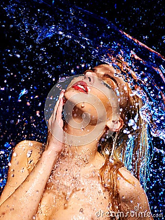 Wet woman face with water drop. Stock Photo