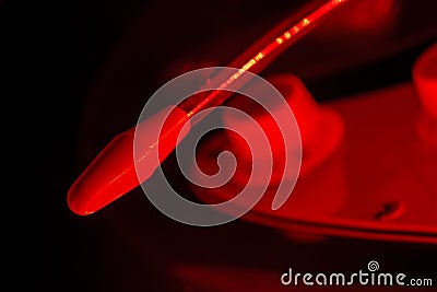 Whammy bar of an electric guitar in red light Stock Photo