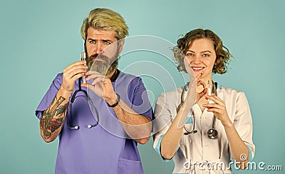 what is better. Medical staff syringe. Team of doctor and nurse meeting cooperating. discussing diagnose. doctors in Stock Photo