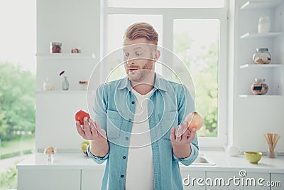 What better for recipe menu Handsome man shrug look at two diff Stock Photo