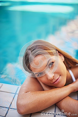 What better way to spend a summer day. a young woman relaxing at a spa pool. Stock Photo