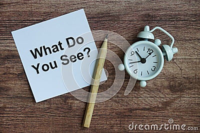 What do you see text on notepad with clock and pencil. Stock Photo