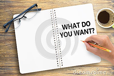 What do you want?. Text on notebook on office desk workplace background Stock Photo