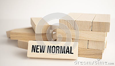 The what NEW NORMAL is written on one of the many scattered wooden blocks Stock Photo