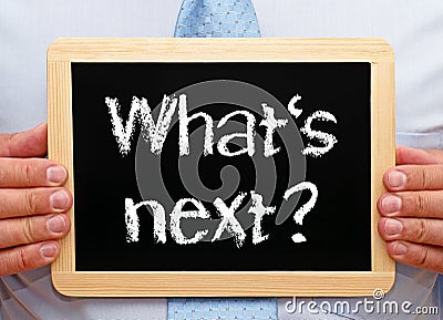 What is next - Manager holding chalkboard with text Stock Photo