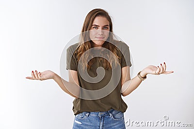 So what not care. Portrait unbothered chill relaxed clueless charming female shrugging hands spread sideways unaware Stock Photo