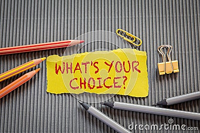 What`s Your Choice. Text on torn, yellow paper Stock Photo