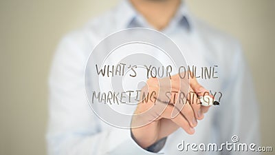 What's Your Online Marketing Strategy, man writing on transparent screen Stock Photo