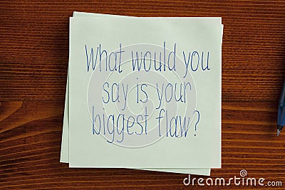 What would you say is your biggest flaw written on a note Stock Photo