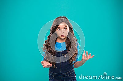 What are you talking about. Kid stunned bewildered emotion can not believe her eyes. Girl curly hairstyle wondering Stock Photo
