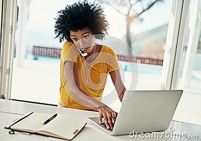 What. a young woman working in a panic at home on her laptop. Stock Photo