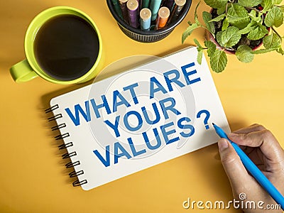 What are your core values, text words typography written on book against yellow background, life and business motivational Stock Photo