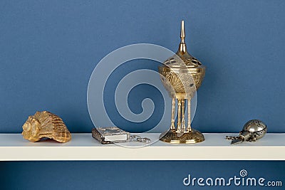 Whatnot and sundries on white shelf Stock Photo