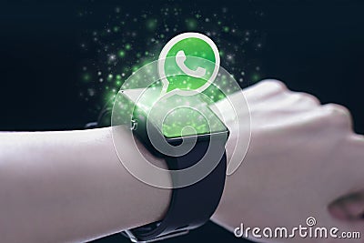Whatsapp application with smartwatch. Editorial Stock Photo