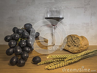 A wheat bread and red grapes with wine Stock Photo