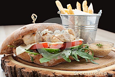 Wheat chicken sandwich burger, fried potatoes, mustard sauce. Se Stock Photo