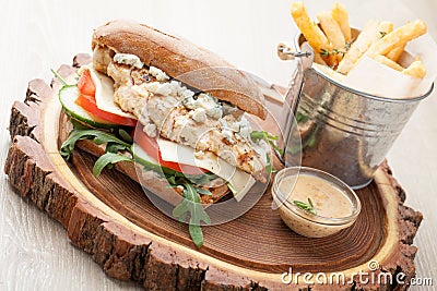 Wheat chicken sandwich burger, fried potatoes, mustard sauce. Se Stock Photo