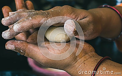 Wheat Dough in the hands of Indian Woman Stock Photo