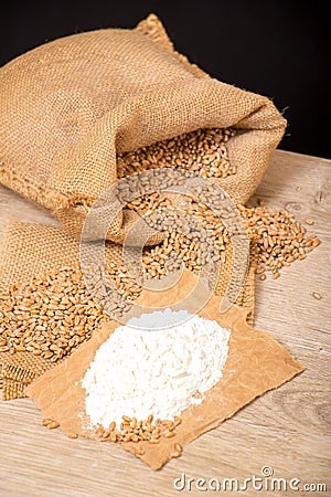 Wheat grains and flour Stock Photo