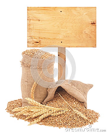 Wheat grains with wooden price tag Stock Photo